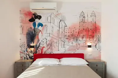 a bedroom with a mural of a woman on the wall at Vittoria C Elegant Apt Near Vatican & Dome View in Rome
