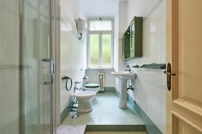 a bathroom with a toilet and a sink at Relax a Trastevere in Rome