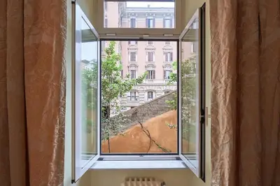 an open window with a view of a building at Relax a Trastevere in Rome