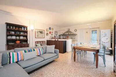 a living room with a couch and a table at Penthouse 5 minutes from the Vatican - 5 bedrooms & 4 bathrooms in Rome