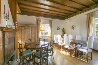 a dining room with a wooden table and chairs at Rome Garden Hill in Rome