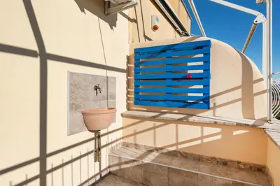 a room with a window and a toilet on a wall at Cielo di Roma con Terrazzo - Self Check-in 24h in Rome