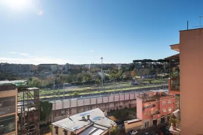 a view of a city with a train track at Cielo di Roma con Terrazzo - Self Check-in 24h in Rome