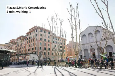 a group of people sitting on a bench on a city street at Cielo di Roma con Terrazzo - Self Check-in 24h in Rome
