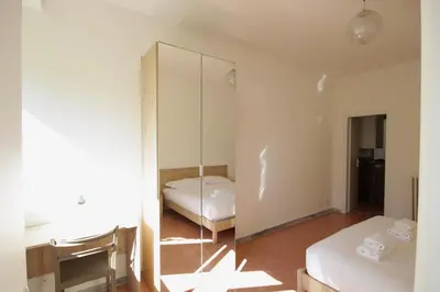 a bedroom with a mirror and a bed in it at HC - Stadio Olimpico Huge Apartment NEW in Rome