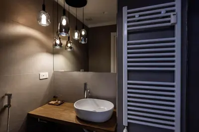 a bathroom with a white bowl sink on a counter at G MARCONI Rooms & Suites in Rome