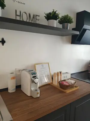 a kitchen counter with a toaster on a wooden counter top at G MARCONI Rooms & Suites in Rome