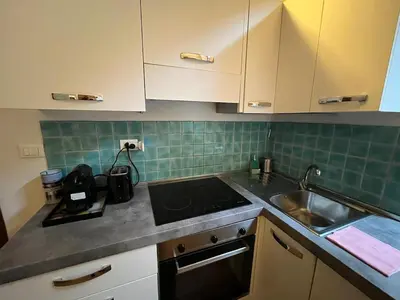 a kitchen with a sink and a counter top at La Dolce Vita - Rione Campo Marzio the Beating Heart of Rome in Rome
