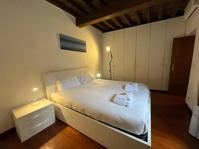 a bedroom with a bed with two towels on it at La Dolce Vita - Rione Campo Marzio the Beating Heart of Rome in Rome