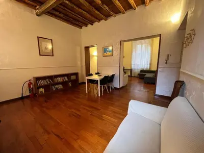 a living room with a couch and a table at La Dolce Vita - Rione Campo Marzio the Beating Heart of Rome in Rome