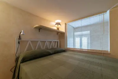 a small bathroom with a washing machine and a sink at GuestHost - Roma Tiburtina Apartment in Rome