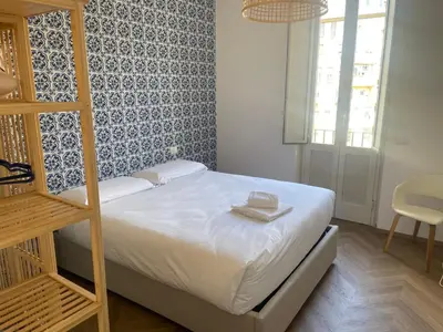 a bedroom with a bed with a book on it at Giulio al MAXXI Apartment Flaminio in Rome