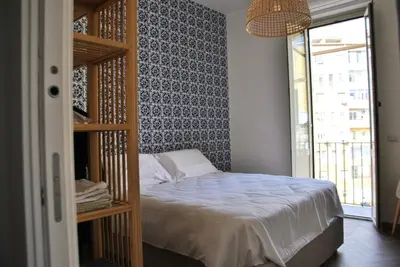 a bedroom with a bed and a book shelf at Giulio al MAXXI Apartment Flaminio in Rome