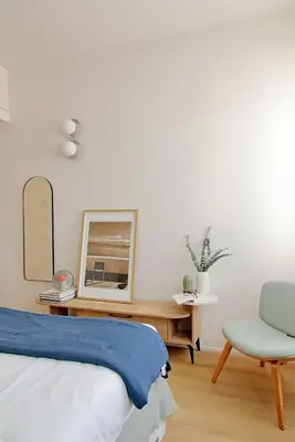 a bedroom with a bed and a chair and a mirror at YCH-Eleganza e confort vicino metro re di Roma in Rome