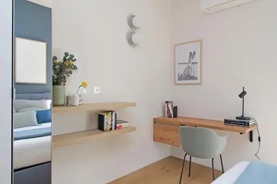 a bedroom with a desk and a bed at YCH-Eleganza e confort vicino metro re di Roma in Rome
