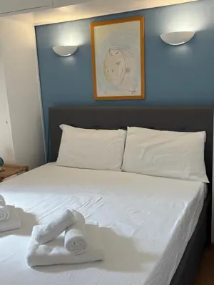 a bedroom with a bed with a towel on it at Spagna Suite Dream by Ghor in Rome