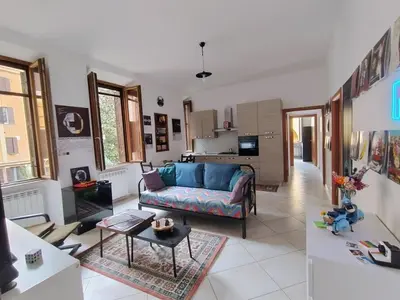 a living room with a couch and a table at Casa del Vinile Roma in Rome