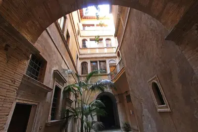 an empty hallway with a staircase in a building at Roma Centro Storico - Palazzo Avila '500 in Rome