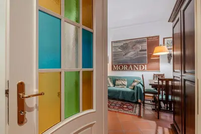 a door leading into a living room with a couch at Your cozy place at the Vatican in Rome
