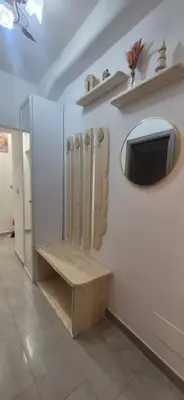a dressing room with a bench and a mirror at Leone Bed & Dreams in Rome