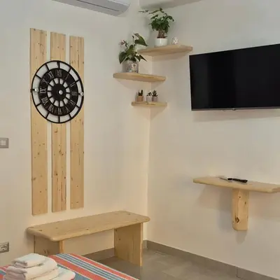 a living room with a dart board on the wall at Leone Bed & Dreams in Rome