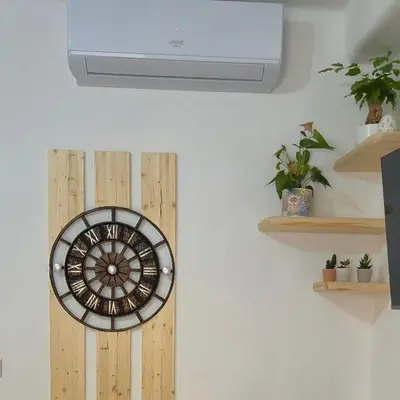 a wall clock on a wall with a ceiling at Leone Bed & Dreams in Rome