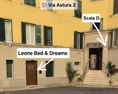 a building with two signs on the side of it at Leone Bed & Dreams in Rome
