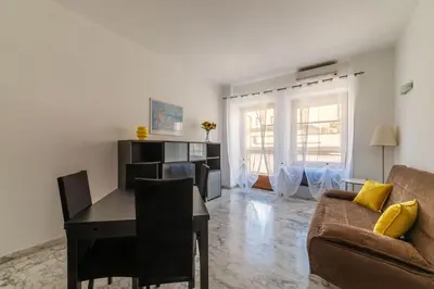 a living room with a table and a couch at GuestHost - Roma MM Repubblica Apartment in Rome