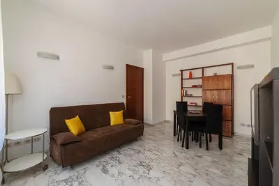 a living room with a couch and a table at GuestHost - Roma MM Repubblica Apartment in Rome