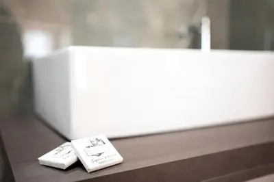 two toothbrushes sitting on a counter next to a sink at C&P Luxury Guest House Rome in Rome