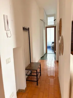 a hallway with a bench and a table at Ad Maiora Domus in Rome