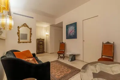 a living room with a couch and a mirror at Sinopia Home Gallery - WelcomeToRhome in Rome