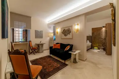 a living room with a couch and a table at Sinopia Home Gallery - WelcomeToRhome in Rome