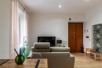 a living room with a couch and a table at GuestHost - Domus Antoniana - Esquilino in Rome