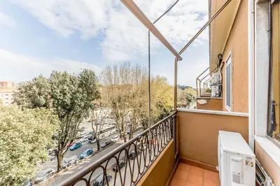 a balcony with a view of a street at Casa Nina Ostiense - Roma Tre - by GHOR in Rome