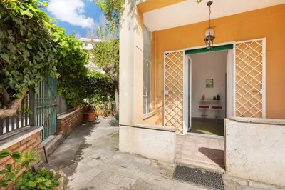 an entrance to a house with an open door at San Paolo Private Garden Home in Rome