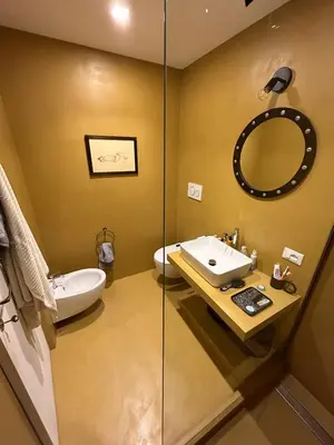 a bathroom with a sink and a mirror at Bright Apartment in San Lorenzo - Feel at Home in Rome