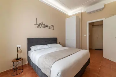 a bedroom with a large bed in a room at GuestHost - AppioLatino Apartment Roma in Rome