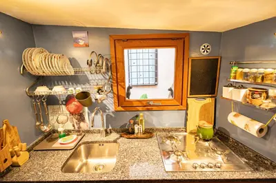 a kitchen counter with a sink and a window at old town Holy Door of Santa Maria Maggiore in Rome