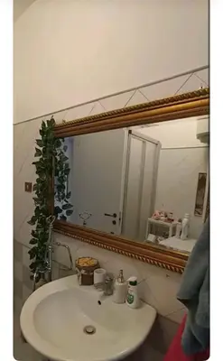 a bathroom with a sink and a mirror at Casa Serenissima Holiday Home Roma Barbara Bonanno in Rome