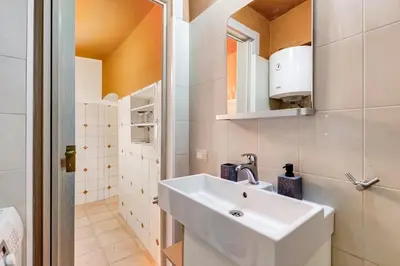 a bathroom with a sink and a mirror at BDC - The ancient Aqueduct in Rome