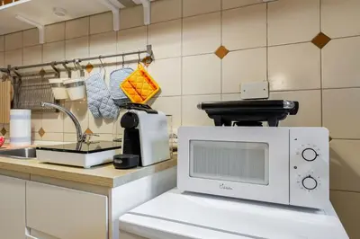 a microwave sitting on a counter in a kitchen at BDC - The ancient Aqueduct in Rome
