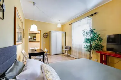 a bedroom with a bed and a table and a desk at BDC - The ancient Aqueduct in Rome