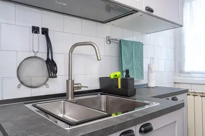a kitchen with a stainless steel sink in a kitchen at Domus Bonadies - Musei Vaticani - San Pietro in Rome