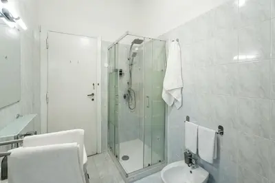 a bathroom with a shower and a toilet and a sink at Domus Bonadies - Musei Vaticani - San Pietro in Rome