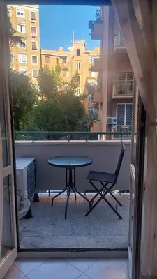 a table and a chair on a balcony at At the Pope's bridge in Rome