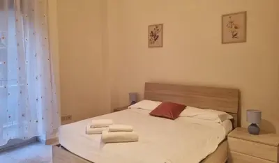 a bedroom with a bed with towels on it at At the Pope's bridge in Rome