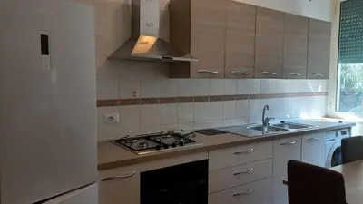 a kitchen with a sink and a stove top oven at At the Pope's bridge in Rome