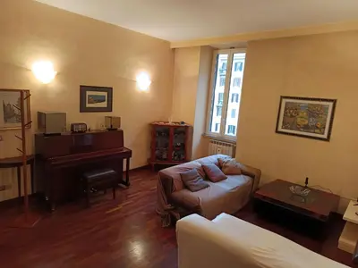 a living room with a couch and a piano at Milizie Vintage in Rome