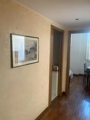 a painting hanging on a wall in a room at Milizie Vintage in Rome